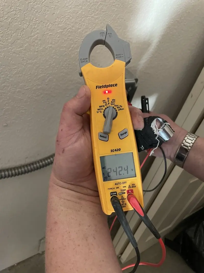 Voltage testing with clamp meter during Outlet Installation in Squaw Valley
